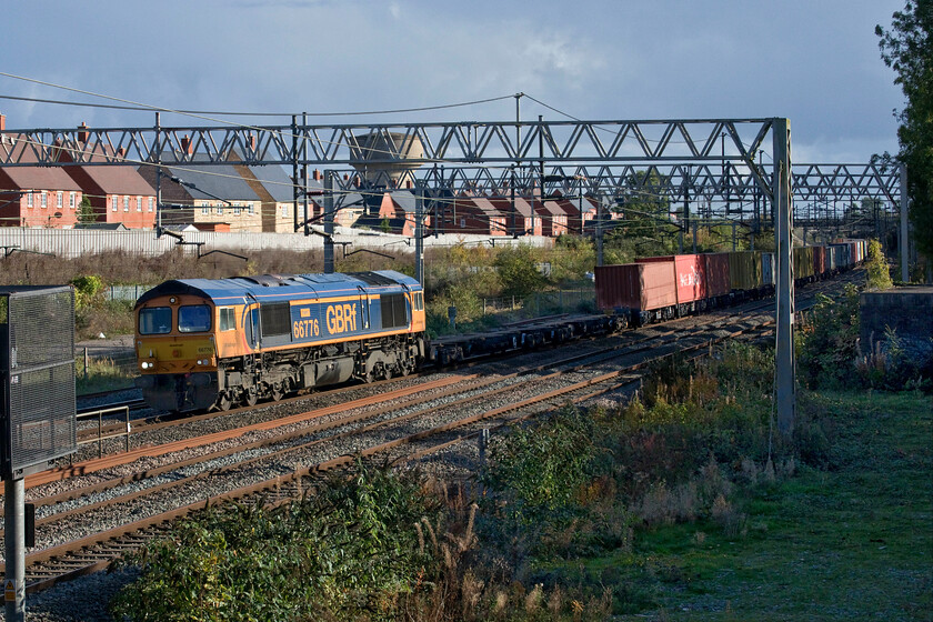 66776, 10.36 Felixstowe North-Hams Hall (4M23, 3L), site of Roade station 
 66776 'Joanne' catches the late afternoon sunshine as it passes the site of Roade's former station. The GBRf Class 66 is leading the 4M23 10.36 Felixstowe to Hams Hall service, one that I have photographed a number of times around this location over the last few years or so being led by a variety of GBRf's finest! 
 Keywords: Joanne 66776 10.36 Felixstowe North-Hams Hall 4M23 site of Roade station GBRf