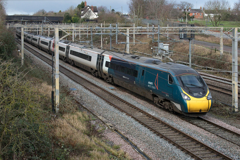 390134, VT 10.58 Preston-London Euston (1A16, 3L), site of Roade station 
 Just catching some welcome brightness on what is an otherwise cold and dreary day 390134 'City of Carlisle' sweeps past Roade with the 10.58 Preston to Euston service. This is my first photograph of this Pendolino wearing its recently applied Avanti livery. 
 Keywords: 390134 10.58 Preston-London Euston 1A16 site of Roade station Avanti West Coast Pendolino City of Carlisle