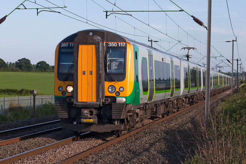 350117, LN 17.49 London Euston-Birmingham New Street (1W67, 1L), Milton Malsor 
 350117 leads two other Desiro units past Milton Malsor near Northampton. The twelve-car train is forming the limited stop 17.49 1W67 London Euston to Birmingham New Street. 
 Keywords: 350117 1W67 Milton Malsor