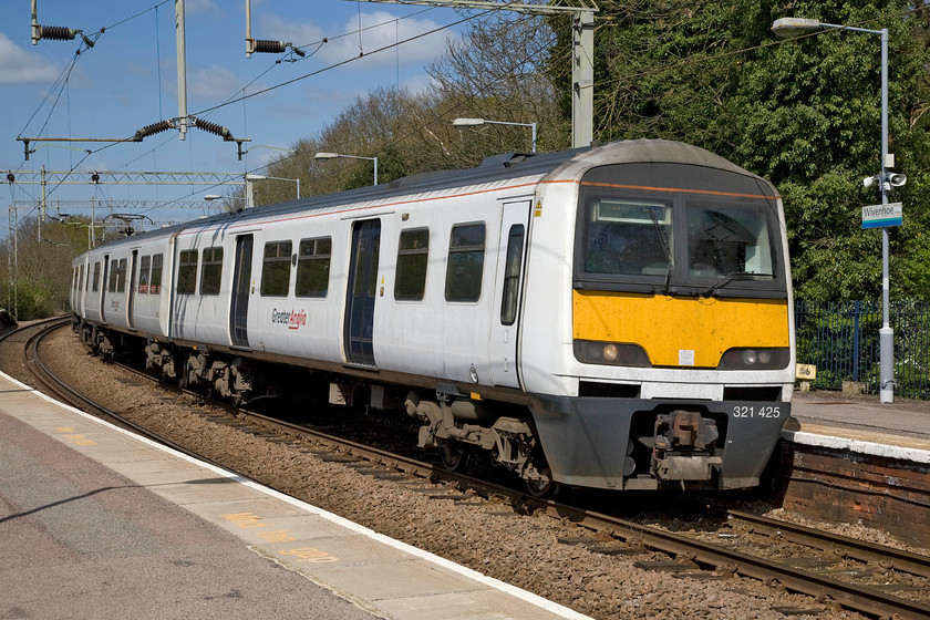 321425, LE 11.56 Colchester-Walton-on-the-Naze (2F38), Wivenhoe station 
 Up until 2010, this unit was seen almost every day passing my home patch on the WCML just south of Northampton, indeed I travelled on it a number of times. Then, it was leased by London Midland but still wearing its Silverlink (1997-2007) livery. Some four years later it is now sporting a smart Abellio Greater Anglia paint job and seen arriving at Wivenhoe station with the 11.56 Colchester to Walton-on-the Naze train. 
 Keywords: 321425 11.56 Colchester-Walton-on-the-Naze 2F38 Wivenhoe station Abellio Greater Anglia