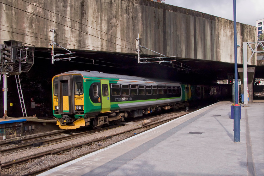 153264 & 150107, LM 07.34 Hereford-Birmingham New Street (1M57), Birmingham New Street station 
 London Midland relies on eight single-car Class 153s to supplement its peak services operated by class 150s. In this particular case, 153264 leads 150107 into Birmingham New Street with the 07.34 commuter service from Hereford. 
 Keywords: 153264 150107 07.34 Hereford-Birmingham New Street 1M57 Birmingham New Street station London Midland