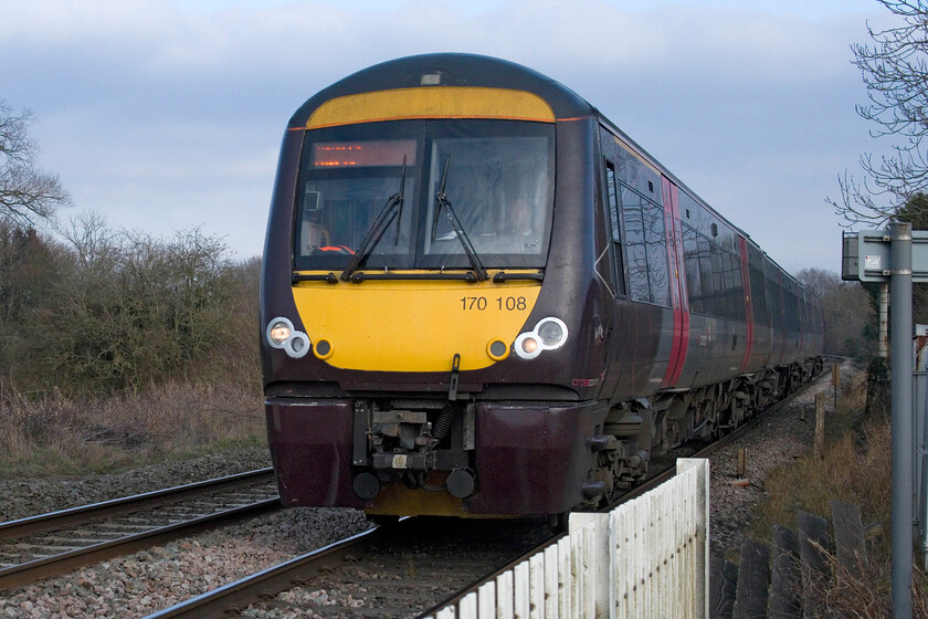 170108, XC 12.27 Stansted Airport-Birmingham New Street (1N55, 3L), Frisby level crossing 
 170108 passes Frisby level crossing working the 12.27 Stansted Airport to Birmingham New Street CrossCountry service. The signalman engaged Andy and me in conversation, standing atop his signal box steps to the left of this image and revealed that he was a follower of my activities through this website; nice to know that I'm getting out there! 
 Keywords: 170108 12.27 Stansted Airport-Birmingham New Street 1N55 Frisby level crossing. CrossCountry