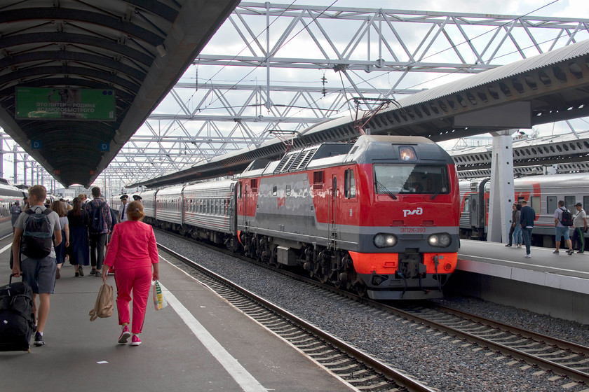 EP2K-393, unidentified working, St. Petersburg Moskovsky station 
 EP2k-393 arrives at St. Petersburg Moskovsky station with an unidentified service from the south. With very few units in sight, it was pleasure to see that this station was largely full of long to medium distance loco-hauled trains. Bucking the trend throughout much of Europe, and the rest of the world for that matter, Russian Railways appears to be developing and expanding their locomotive-hauled trains but with the distances that they cover, I suppose this makes sense. 
 Keywords: EP2K-393 St. Petersburg Moskovsky station