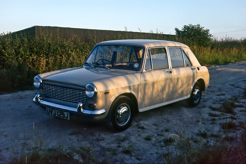 UVJ 129J, Hawkeridge Junction 
 Basking in the evening sunshine near to Hawkeridge Junction just east of Westbury is Graham's new and shiny Austin 1100, UVJ 129J. This car became a dependable grice machine for the next year or so. At this time it was nine years old and had been well looked after by its previous owner, Graham's father. Graham was to be its last keeper with it being retired to the great scrapyard in the sky in the autumn of 1984. 
 Keywords: UVJ 129J Hawkeridge Junction Austin 1100