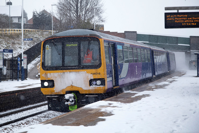 144016, NT 10.13 Huddersfield-Sheffield (2B39, 9L), Elescar station 
 It was really beginning to snow by now here at Elescar and the wind was whipping it around. 144016 runs non-stop through the station working the Northern Rail 2B39 10.10 Huddersfield to Sheffield working. 
 Keywords: 144016 2B39 Elescar station