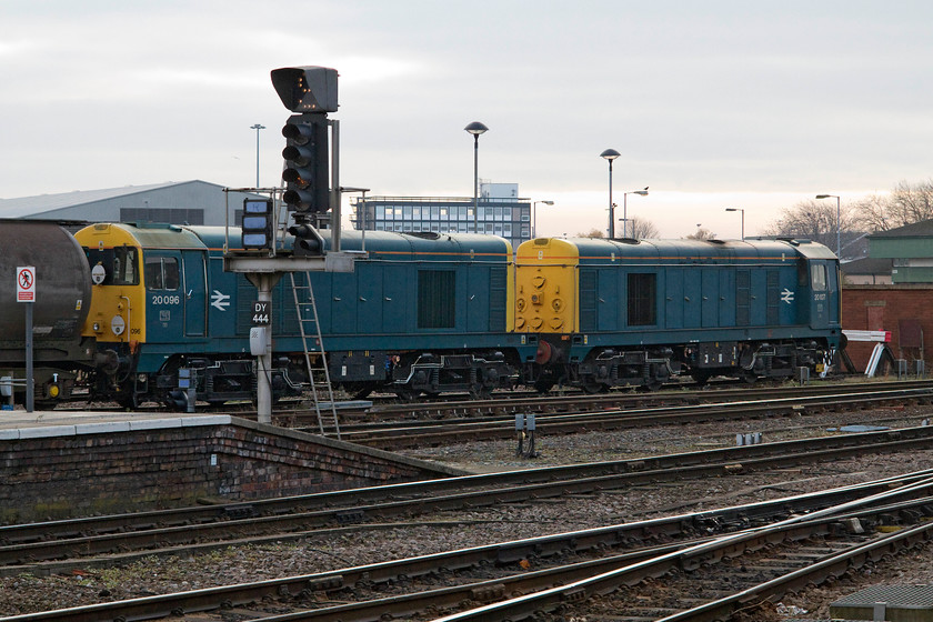 20096 & 20107, stabled, Derby station 
 Two vintage type ones stand stabled at the southern end of Derby station. 20096 and 20107 look smart in their retro. BR blue livery sitting in their default nose to nose formation. 
 Keywords: 20096 20107 stabled, Derby station