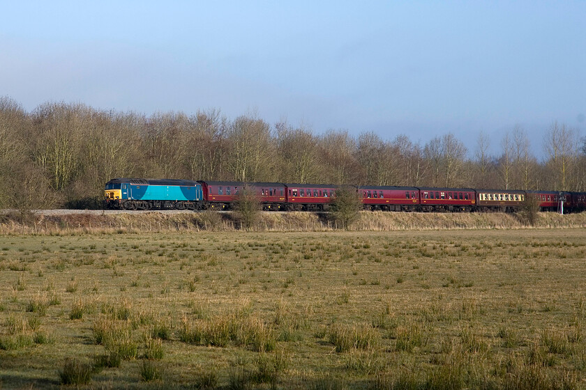 57314, outward leg of the 'Heart of Wales', 05.02 Cardiff Central-Oxford (circular route via Welsh Marches) (1Z39), King's Sutton SP498354. 
 Close examination of 57314 reveals that its Arriva Trains Wales branding has almost disappeared with just the faintest outline of the vinyls on its flanks. It is seen passing near King's Sutton at the rear of The Heart of Wales charter running as 1Z39. The charter left Cardiff at 05.02 to end up at Shrewsbury for steam haulage back to the principality along the beautiful Welsh Marches line. Unfortunately, for the punters on board, the bright weather here in Northamptonshire gave way to torrential rain later in the day exactly as the Met. Office forecast! 
 Keywords: 57314, Heart of Wales 05.02 Cardiff Central-Oxford circular route via Welsh Marches 1Z39 King's Sutton SP498354