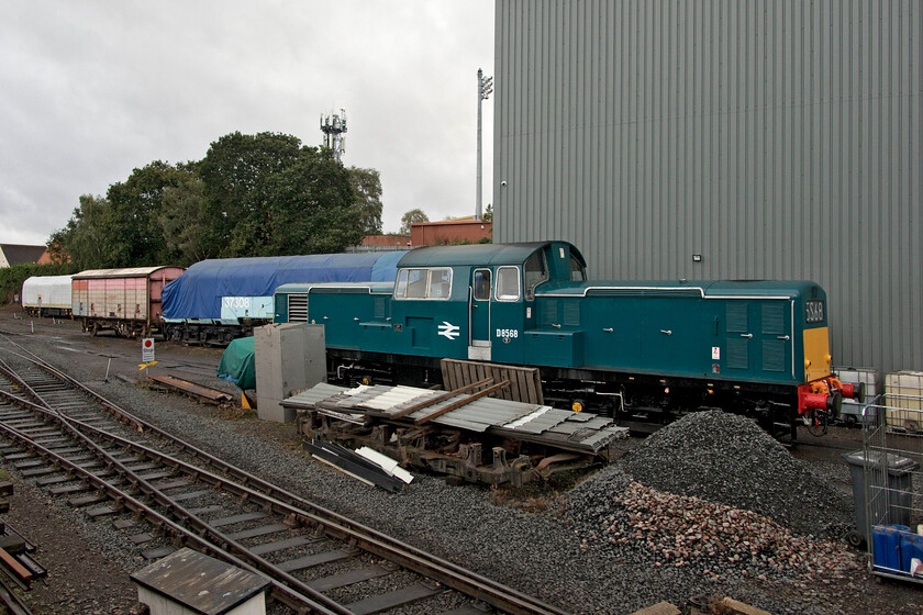 D8568, stabled & 37308, stored, Kidderminster depot 
 Having been in service earlier in the day Class 17 Clayton D8568 rests at Kidderminster depot. I am not sure if it had developed a problem but it was supposed to be working the 16.55 Kidderminster to Bewdley shuttle in the next few minutes? Behind the Clayton, shrouded in a tarpaulin, is 37308 the last built member of the class. Since entering preservation back in 2007 it has been undergoing a protracted restoration at various locations but extensive and largely unseen rust around the cab ends and floors has slowed progress greatly. Work is underway again being undertaken by the SVR itself for use on the line. 
 Keywords: D8568 37308 Kidderminster depot Clayton