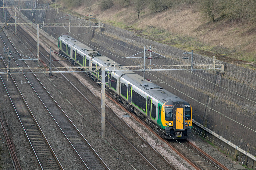 350105, LM 13.14 Birmingham New Street-London Euston (1Y46), Roade Cutting 
 350105 forms the 13.14 Birmingham New Street to London Euston 1Y46 service. It is seen passing through Roade Cutting just over sixty miles from its destination. As a 'fast' service, it's a journey that will take just over an hour. 
 Keywords: 350105 13.14 Birmingham New Street-London Euston 1Y46 Roade Cutting