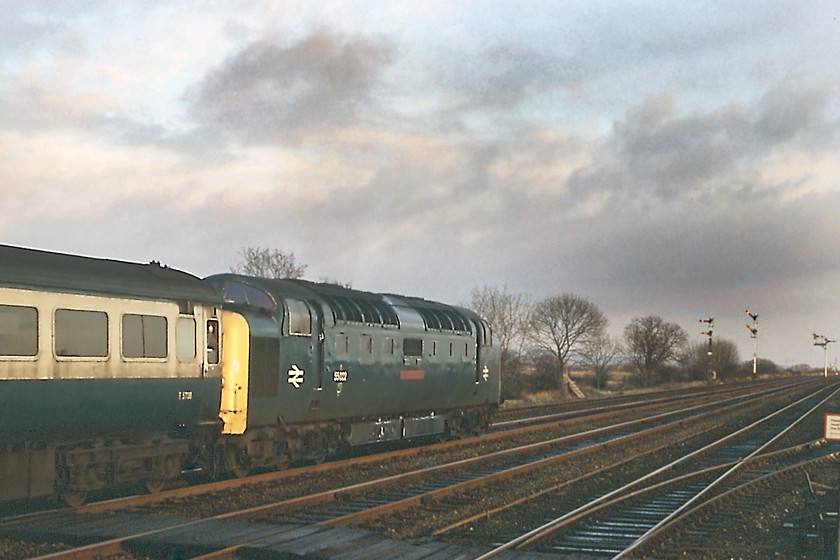 55022, 12.05 King's Cross-Hull (1D02), Gilberdyke station 
 I am not a particular fan of 'going-away' shots but I must have been overcome by events on this cold late afternoon at Gilberdyke station! 55022 'Royal Scots Grey' makes a heck of a row as it powers away on towards its destination just seventeen miles away from here. The twin down signal posts are controlled by Oxmardyke crossing box and Gilberdyke signal box. The starters/homes being controlled by the former and the distants by the latter. The black clouds seen gathering in the east were to dump a load of snow on us later in the evening hampering our drive from Hull to York.

There is an audio recording of this event on my Youtube channel, see.. https://youtu.be/HaXxiofriXY 
 Keywords: 55022 12.05 King's Cross-Hull 1D02 Gilberdyke station Royal Scots Gray Deltic