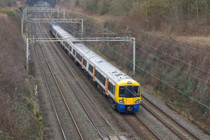 378225 & 37611, 10.46 New Cross Gate-Widness Transport Tech (5Q46, 5E), Hyde Road bridge 
 This is not a scene very often! A London Overground Capitalstar passes through Roade cutting running as 5Q46, the 10.46 New Cross Gate to Widness Transport Tech. It is not running under its own power with ROG's 37622 'Denise' enthusiastically leading the train with plenty of English Electric thrash. I am not sure as to why the Capitalstar is being dragged to Widness as I am not aware of an overhaul programme relating to these units....can anybody advise? 
 Keywords: Denise 378225 37611 10.46 New Cross Gate-Widness Transport Tech 5Q46 Hyde Road bridge London Overground Capitalstar