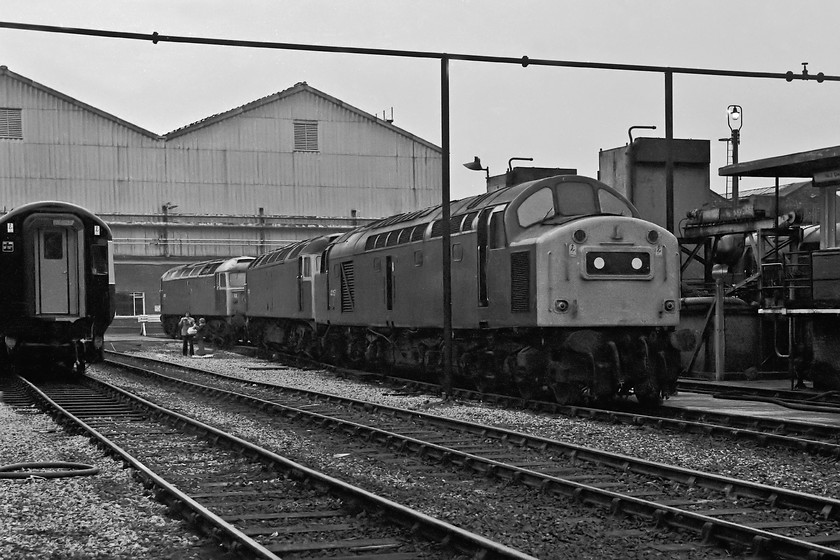 Class 43, 47457, 47204 & 40157, Crewe Works 
 To the left of this image. taken at Crewe Works is the rear end of a Class 43 HST power car with its connecting door on view. Unfortunately, my records reveal that it is one power car of set 254031 or 254029, can anybody help identify it? In the line up of locomotives, 40157 leads the trio with 47204 and 47457. The 40 was on the works for main generator repairs, it left at the beginning of March to resume its duties on the Scottish Region. 
 Keywords: Class 43 47457 47204 40157 Crewe Works