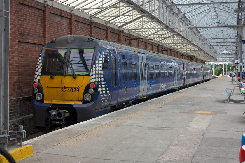 334029, stabled, Helensburgh Central station 
 334029 sits stabled under the overall roof at Helensburgh Central station. Another lovely station befitting of the town in which it is centrally located. Andy and I took a very pleasant lunch sitting on the rocks overlooking the Clyde a short distance from the station. 
 Keywords: 334029 Helensburgh Central station