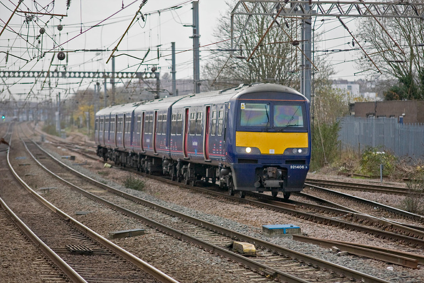 321406, GR 09.05 London King's Cross-Cambridge (2C08), Alexandra Palace station 
 321406 approaches Alexandra Palace station working the Great Northern 09.05 King's Cross to Cambridge service. Since its opening in 1859 it has been known as Wood Green (1859-1864), Wood Green (Alexandra Park) (1864-1971), again Wood Green (1971-1982) and then Alexandra Palace (from 1982). 
 Keywords: 321406 GR 09.05 London King's Cross-Cambridge 2C08 Alexandra Palace station Dusty Bins Great Northern Silverlink