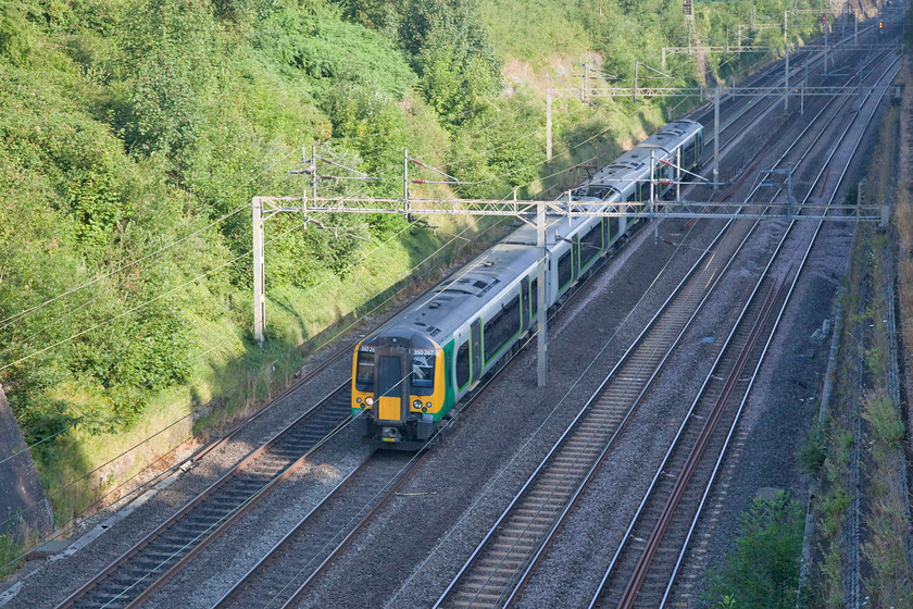 350267, LN 06.01 Crewe-London Euston (1U16, 6L), Roade Cutting 
 It is not quite late enough for the up fast line in Roade Cutting to be in sun yet, about 15 minutes later and 350267 would be properly lit working the 06.01 Crewe to London Euston. 
 Keywords: 350267 1U16 Roade Cutting