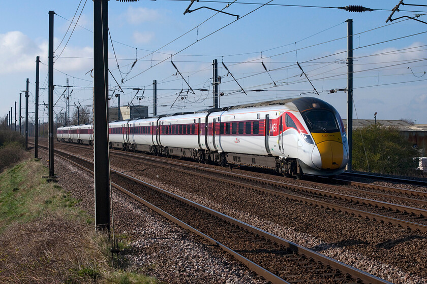 802209, GR 09.06 London King's Cross-York (1N81, 1L), Sandy TL176510 
 With the buildings of the Middlefield Industrial Estate in the background Azuma 802209 heads northwards away from Sandy working the 09.06 King's Cross to York service. Andy and I were hoping to see a Class 91 leading a Mk.4 set as this was one service restored for such a formation. However, with the continued reduction in services caused by the low post-COVID passenger numbers LNER appear to have surplus Azuma availability. 
 Keywords: 802209 09.06 London King's Cross-York 1N81 Sandy TL176510 LNER Azuma