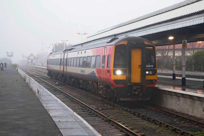 158813, EM 12.45 Nottingham-Skegness (2S17, 3L), Skegness station 
 East Midlands' 158813 comes to a halt at Skegness station arriving at the seaside with the 12.45 from Nottingham. Completing its journey, just three minutes late, I suspect that it will not be carrying many happy holidaymakers on this grey and foggy January afternoon! 
 Keywords: 158813 2S17 Skegness station