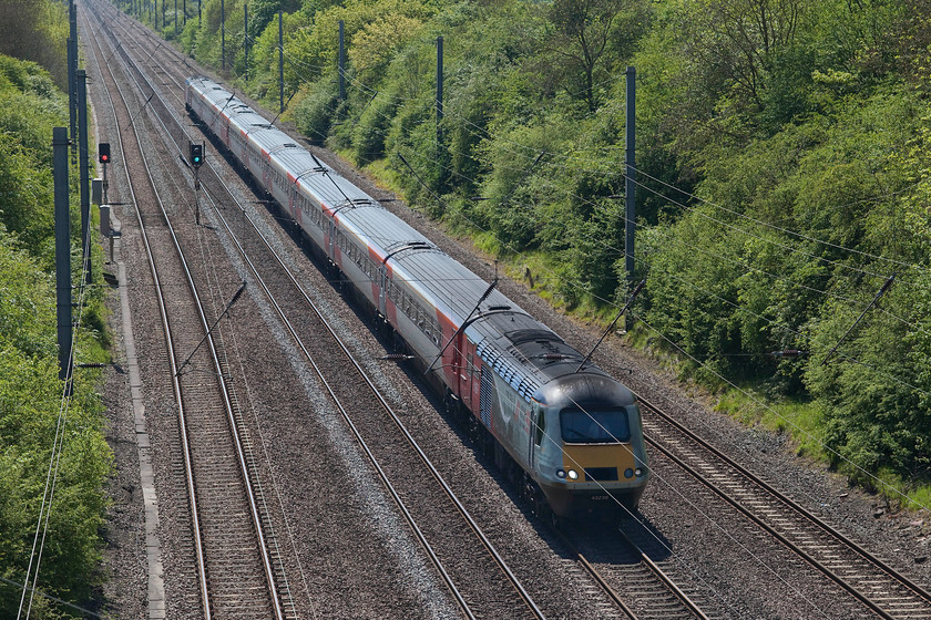 43238, GR 10.00 London King`s Cross-Aberdeen (1S11, 2E), High bridge Westby SK962271 
 43238 'National Railway Museum 40 Years 1975-2015' leads the 10.00 King's Cross to Aberdeen as it approaches the top of the climb of Stoke bank taken from High bridge near the village of Westby. 43238 was an early 1977 power car that first saw use on the Western Region as part of set 253019. The name carried by the power car is the third it has carried, indeed in 1985, it also was named 'National Railway Museum First Ten Years 1975-1985' carrying 'City of Dundee' between 2003 and 2007. 
 Keywords: 43238 10.00 London King`s Cross-Aberdeen 1S11 High bridge Westby SK962271