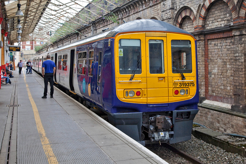 319375, NT 15.48 Crewe-Manchester Piccadilly (2H40, 1L), Crewe station 
 Having always had the class 319s relatively close to my home operating out of Bedford from when they were new, the sight of them in places such as Crewe always seems a little incongruous! Here, 319375 is about to depart to work the 15.48 return working to Manchester Piccadilly. They have been spruced up pretty well by Wolverton works and look fit for service with Northern for a number of years. 
 Keywords: 319375 2H40 Crewe station