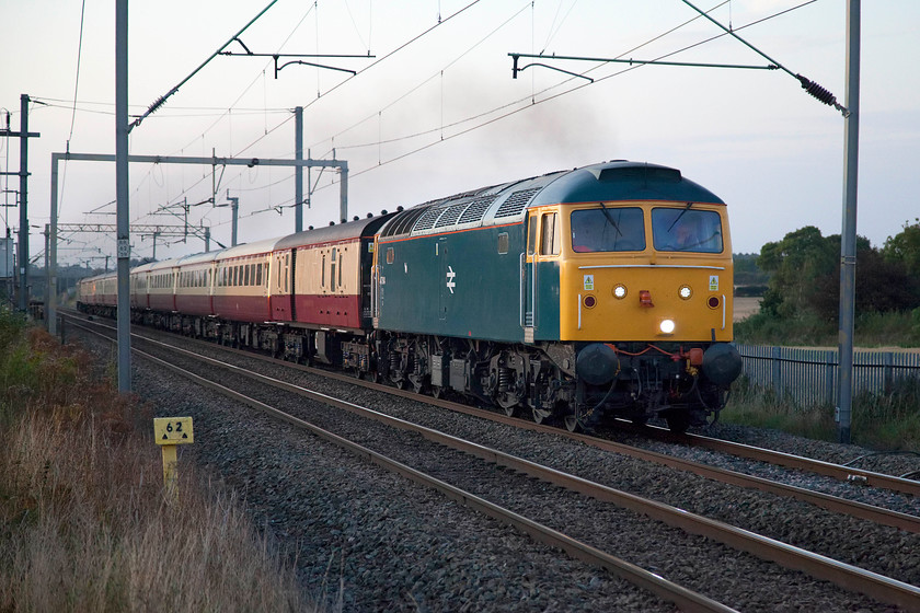 47614, return leg of The Palatine, 17.44 Crewe-London Euston (1Z57), Milton Malsor 
 With last vestiges of sunshine just illuminating the train, 47614 leads returning Palatine railtour back from Crewe to Euston. The combination of the superbly well turned out class 47 in BR blue and the lovely rake of stock operated by Locomotive Services Ltd made the effort to go out after dinner on a Saturday evening well worthwhile. The train has just sixty-two and a half miles to go according to the milepost. 
 Keywords: 47614 The Palatine 17.44 Crewe-London Euston 1Z57 Milton Malsor