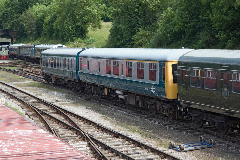 E53599, W51073 & E59303, stabled, Wirksworth yard 
 Three different DMU carriages sit stabled in Wirksworth yard. From left to right, class 108 DMBS E53599, then class 118 DMBS W51073 and finally, in green, class 101 TSL E59303. All of these units are in use on the Ecclesbourne Railway that runs all the way from its namesake to link up with the national network at Duffield. The number of DMUs found on this heritage line are testament to that it is designated as a centre of excellence for DMU restoration. 
 Keywords: E53599 W51073 E59303 Wirksworth yard