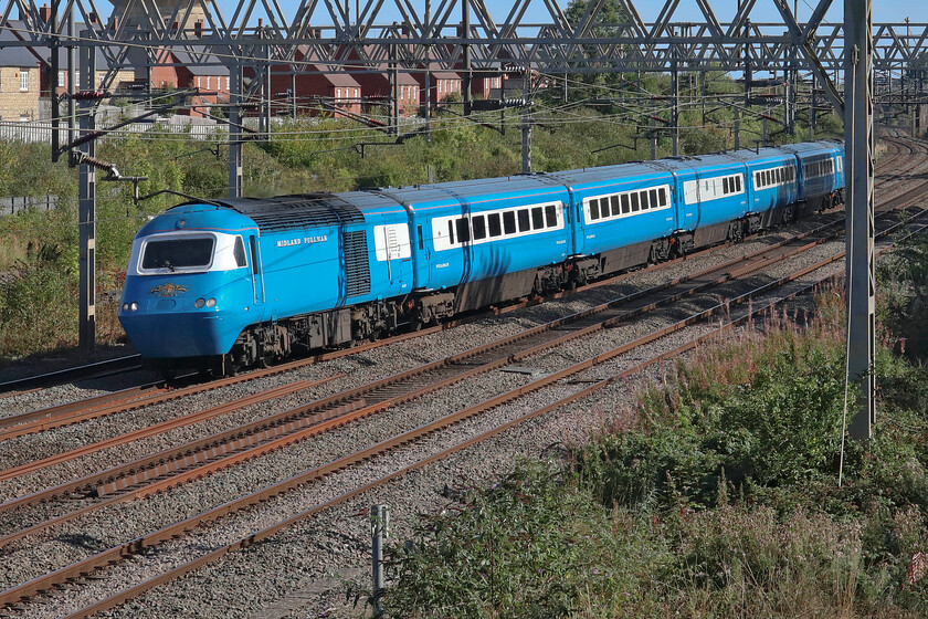 43055 & 43050, 13.29 Southall LSL-Crewe HS (5Z47, 7L), site of Road station 
 Making a fine site as it passes Roade on a superb September afternoon one of LSL's mock Midland Pullman HST sets works the 5Z47 Southall LSL to Crewe HS. The leading power car is 43055 with 43050 'Loch Morar' partially obscured at the rear. The set had been used over the previous three days on the West Highland Pullman charter so was no doubt in need of a service on its return to its base at Crewe. 
 Keywords: 43055 43050, 13.29 Southall LSL-Crewe HS 5Z47 site of Road station LSL HST Loch Morar