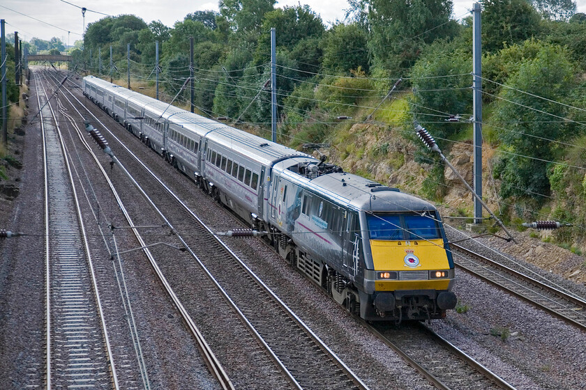 91110, GR 09.03 London King's Cross-Leeds (1D07), Little Bytham TF019171 
 Celebrity liveried 91110 'Battle of Britain Memorial Flight' was named last year at Railfest in York. It certainly strikes a pose wherever it goes and nowhere more than here storming along the ECML at Little Bytham. It is leading the East Coast 1D07 09.03 King's Cross to Leeds service. 
 Keywords: 91110 09.03 London King's Cross-Leeds 1D07 Little Bytham TF019171