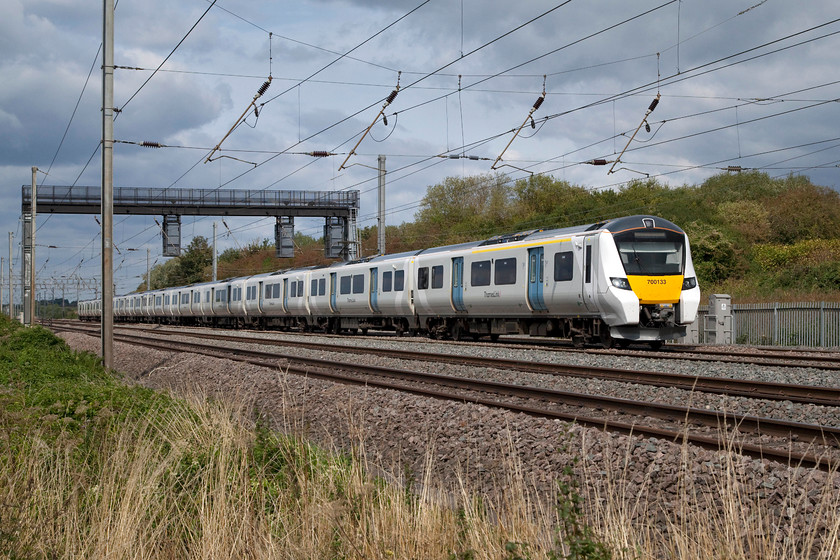 700133, TL 14.05 Bedford-Gatwick Airport (9R33, 1E), Sundon Loops TL034279 
 Having worked to Bedford earlier, 700133 returns with the 9R33 14.05 to Gatwick Airport. It catches a bit of afternoon sun on the five-track section between Harlington and Leagrave called Sundon Loop. As this 12-coach 700/1 passed I observed no more than a handful of passengers aboard. 
 Keywords: 700133 9R33 Sundon Loops TL034279