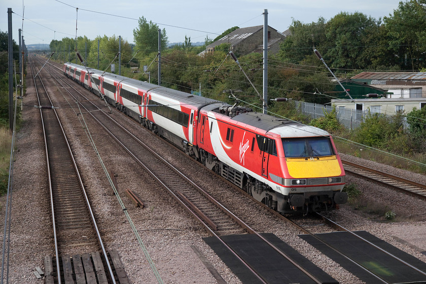 91105, GR 08.35 London Kings Cross-Leeds (1D09, RT), Arlesey footbridge 
 Taken from the footbridge at Arlesey, 91105 speeds northwards heading the 08.35 King's Cross to Leeds. As can be seen, the sun is making a half-hearted attempt to come out, if it does, this will make a pleasant change as the summer of 2017 has been particularly dull! 
 Keywords: 91105 1D09 Arlesey footbridge