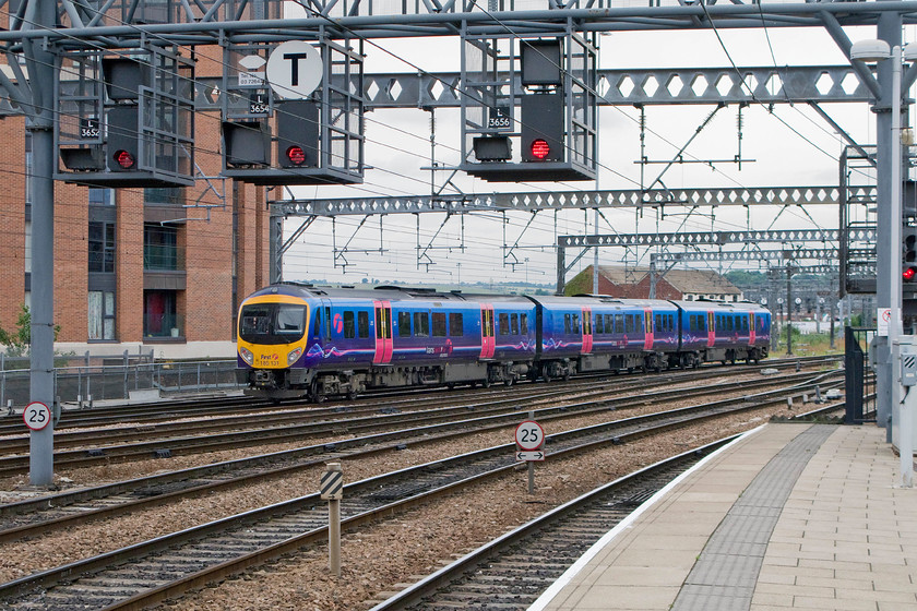 185131, TP 11.53 York-Manchester Airport (1P33), Leeds station 
 The 11.53 York to Manchester Airport leaves Leeds station formed by 185131. TPE operate fifty-one of these high power dmus that belong to the Desiro family of trains built by Siemens. Unfortunately, this subclass of the highly successful family have been blighted by high fuel consumption despite having an eco-mode installed in 2007 that ultimately was removed due to unreliability issues associated with its software. 
 Keywords: 185131 11.53 York-Manchester Airport 1P33 Leeds station TransPennine Express