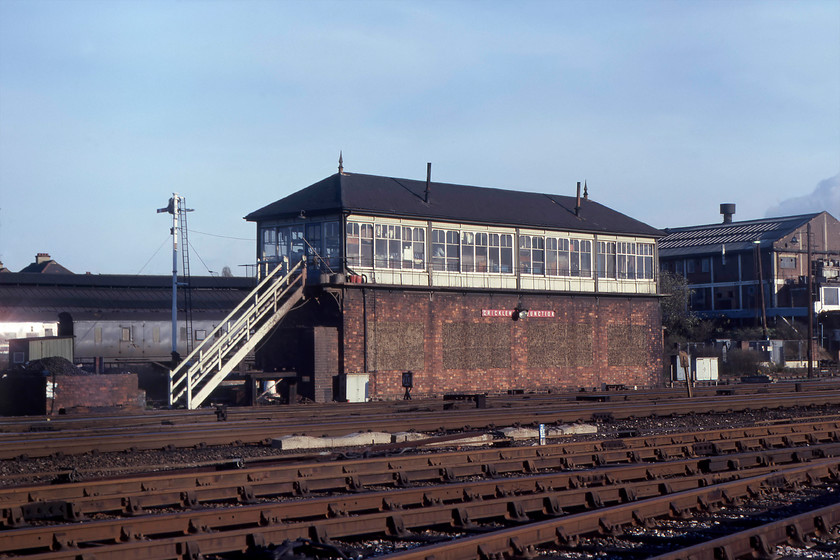 Cricklewood Junction signal box (LMS, 1929) & LMS van 
 A true LMS scene at Cricklewood with the 1929 box and a parcels van basking in the afternoon sunshine. I suspect that this box was double manned given its size and the amount of traffic it handled. In this view, a superb Midland wooden bracket signal that used to sit adjacent to the southern end of the box has been removed. This had a variety of arms including a calling-on arm for shunting purposes. Notice that the windows into the frame room have been bricked up on the box. 
 Keywords: Cricklewood Junction signal box LMS van