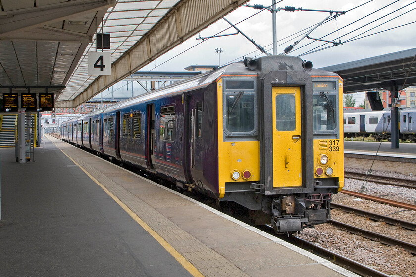 317339, FC 15.55 Cambridge-London King's Cross (2C53), Cambridge station 
 317339 is one of the second batches of the BREL (Derby) of these units that were designated 317/2s that entered service in 1986. Now towards the end of their working lives, they are operated by First Capital Connect for the next two months or so before Govia Thameslink takes over their operations as once again our crazy franchising system undergoes one of its totally unnecessary commercial jerks. 
 Keywords: 317339 15.55 Cambridge-London King's Cross 2C53 Cambridge station