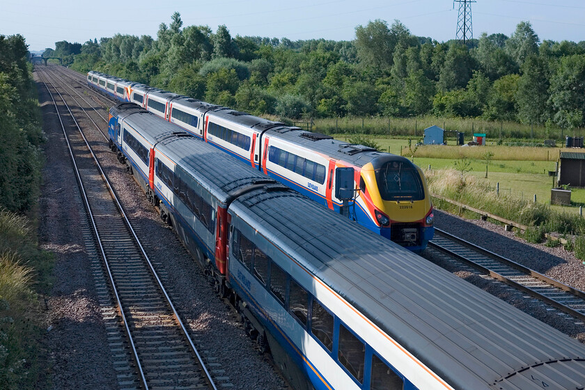 43050, outward leg of the Mallard 75-125 Special, 07.38 London St. Pancras-York (1Z43, 5E) & 222018, EM 07.55 Sheffield-London St. Pancras, Sheffield (1F10), Lower Farm Road, Bromham TL028518 
 As the Mallard 75-125 HST charter passes Bromham on the down slow line 222018 leads another Meridian working the 07.55 St. Pancras to Sheffield service. Normally I would have cursed a rogue train partially obscuring my chosen subject manner but on this occasion, the blocking train is of interest as it's an HST on the slow line. 
 Keywords: 43050 Mallard 75-125 Special 07.38 London St. Pancras-York 1Z43 222018 07.55 Sheffield-London St. Pancras Sheffield 1F10 Lower Farm Road Bromham TL028518 EMT East Midlands Trains HST Meridian