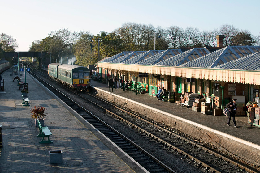 M51188 & M56352, Sheringham-Weybourne ECS, Sheringham station 
 After our visit to Cromer, my wife dropped me in Sheringham and I was going to take the train back to Weybourne for our accommodation at Kelling Heath. However, I had missed the last service train so ended up walking back. It was a beautiful afternoon so a rapid and healthy walk through Sheringham Park was not really a problem! At Sheringham station I was just in time to see M51188 and M56352 leave with the ECS working to Weybourne. The lighting and content of this image gives a really clear view of what the NNR have created at Sheringham station. 
 Keywords: M51188 M56352 Sheringham-Weybourne ECS Sheringham station