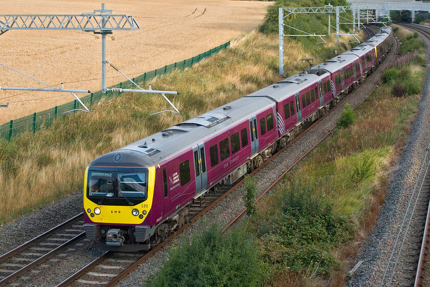 360120 & 360121, EM 06.40 Corby-London St. Pancras-Nottingham (1H06, 2L), Irchester SP927667 
 Taking the up-fast line 360120 and 360121 pass Irchester near Wellingborough working the 06.40 Corby to St. Pancras EMR service. Whilst these former Great Eastern Desiros look smart and are far superior internally when compared to their Class 350 cousins. EMR has just announced that they are to be extensively refurbished over the next few years; no further details are available as yet. 
 Keywords: 360120 360121 06.40 Corby-London St. Pancras-Nottingham 1H06 Irchester SP927667 EMR Desiro