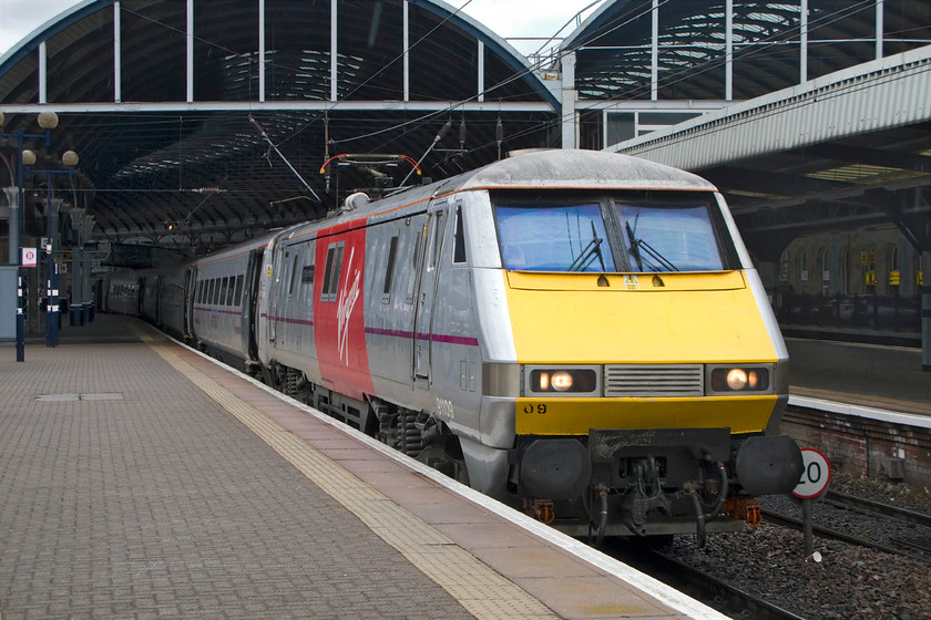 91109, VTEC 13.25 York-Edinburgh Waverely (1F15), Newcastle station 
 91109, named after one of Newcastle's best-known celebrities, 'Sir Bobby Robson' waits at the city's Central station leading the 1F15 13.25 York to Edinburgh express. This train started from York due to engineering works on the line between Colton Junction and Doncaster. 
 Keywords: 91109 13.25 York-Edinburgh Waverely 1F15 Newcastle station Virgin east coast Sir Bobby Robson