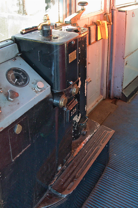 Controls, 483006, Ryde Pier Head station 
 The driver of 483006 permitted me to take a picture through the door of 483006 at Ryde Pier Head station. The driver's cab is compact to say the least and lacks a few modern comforts. The controls are pretty basic with the most modern part being the grey panel to the left that was added when the units were converted by BR for use on the island in 1989 following the retirement of the 1923 Class 485 and 486 stock. 
 Keywords: Controls 483006 Ryde Pier Head station Island Line SWT 1938 London Underground stock