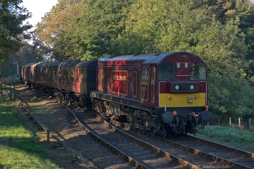 20227, 10.35 Holt-Sheringham, Weybourne station 
 Having worked the first train of the day to Holt, 20227 'Sherlock Holmes' drifts down Kelling Bank into Weybourne with the 10.35 return working to Sheringham. In the autumn (and winter) the sun struggles to illuminate this part of the line but I do like the dappled lighting through the trees that are just managing to hang on to their leaves. 
 Keywords: 20227 10.35 Holt-Sheringham Weybourne station