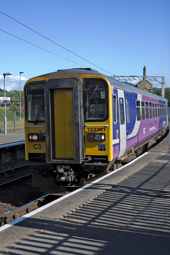 153301, 06.00 Maryport-Lancaster, Carnforth station 
 153301 arrives at Carnforth station working the 06.00 Maryport to Lancaster Northern service. The former Furness Carnforth Station Junction signal box can be seen above the rear of the train. 
 Keywords: 153301 06.00 Maryport-Lancaster Carnforth station