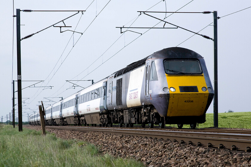 43208, GR 11.47 Aberdeen-London King's Cross (1E19), Frinkley Lane crossing SK906436 
 One of my trademark low angle photographs that I took a lot of in my early spotting days, see..... https://www.ontheupfast.com/p/21936chg/23615748404/class-120-dmu-c503-bathampton-junction This time, nearly forty years later, an East Coast HST being led by 43208 passes Frinkley Lane crossing working the 11.47 Aberdeen to King's Cross. 43208 is a former Western Region power car that carried the number W43008 and was part of 253004 that I photographed back in 1977 on my home turf, see..... https://www.ontheupfast.com/p/21936chg/23615752604/passing-under-kennet-avon-canal 
 Keywords: 43208 11.47 Aberdeen-London King's Cross 1E19 Frinkley Lane crossing SK906436 East Coast HST Lincolnshire Echo