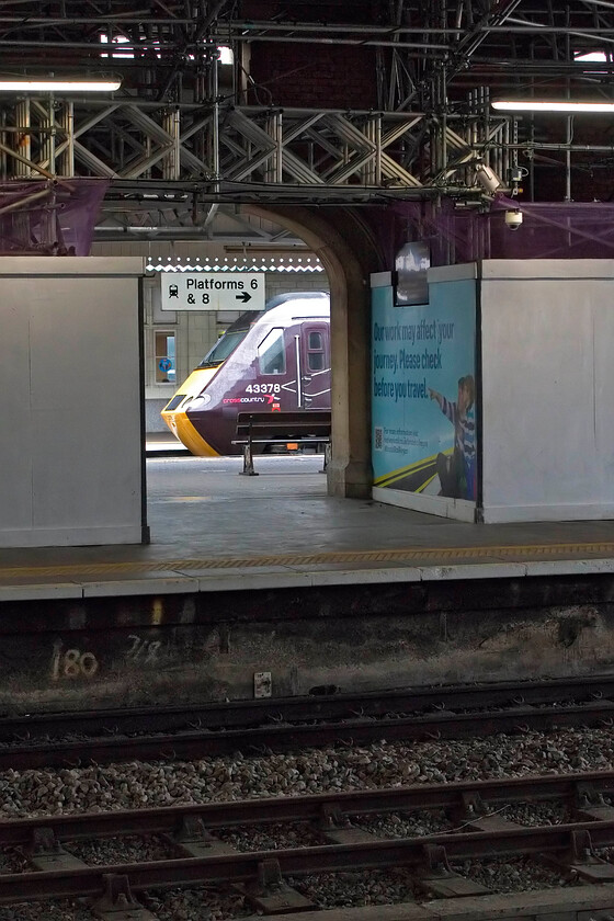 43378, XC 06.06 Edinburgh Waverley-Plymouth (1V50, 9L), Bristol Temple Meads station 
 As we were approaching Stapleton Road station aboard 168205 CrossCountry's 1V50 06.06 Edinburgh to Plymouth HST service passed us on the fast line. We did not expect it to still be at Temple Meads when we arrived but were pleased that it was even if we were on the wrong side of the station. In this interesting view, which shows evidence of the massive refurbishment of the trainshed, the rear power car, 43378, is seen through a gap in the platform. Even though it looks a little brighter it was still raining, as it did for the whole of our day out really! 
 Keywords: 43378 06.06 Edinburgh Waverley-Plymouth 1V50 Bristol Temple Meads station CrossCountry HST