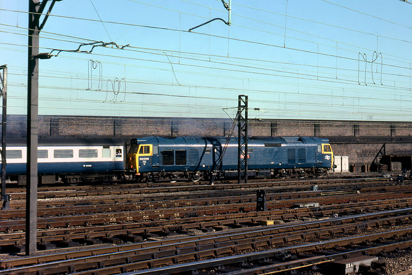 50008, return leg of The Crewe Invader, 15.55 Crewe-Plymouth (1Z85), Crewe station 
 Looking superb having just had a coat of paint and a scrub up, probably to coincide with its heading The Crewe Invader railtour that is seen leaving Crewe station. This railtour left at 15.55 for Plymouth via Hereford (reversal), Malvern, Worcester, Gloucester and Bristol. The coaches would be full of very contented enthusiasts studying their notebooks having been to Crewe Works open day, no doubt assessing their cops ready to reach for the ruler and pen! 
 Keywords: 50008 The Crewe Invader 15.55 Crewe-Plymouth 1Z85 Crewe station