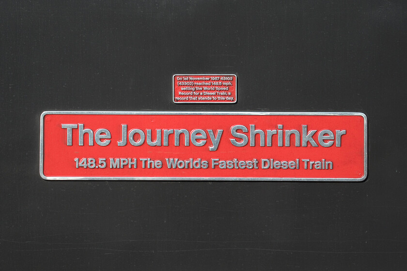 Nameplate, 43102 (43302), EM 05.19 Leeds-London St. Pancras (1C15, 4E), Wellingborough station 
 To commemorate the ending of HST use on the MML, power car 43102 (formerly numbered 43302 and operated by LNER) has received a superb retro. InterCity Swallow livery and has been named 'The Journey Shrinker'. As stated in the smaller plate affixed to the flanks of the power car it achieved the feat as the fastest diesel train in November 1987 reaching 148.5 mph on a test train between Northallerton and York. It is unfortunate that somebody did not grammar check the text before the sign was sent to be cast as an apostrophe has been missed from the subtitle on the plate but I suppose that will add to its value in the future! 
 Keywords: 43102 43302 05.19 Leeds-London St. Pancras 1C15 Wellingborough station East Midland Railway HST The Journey Shrinker nameplate