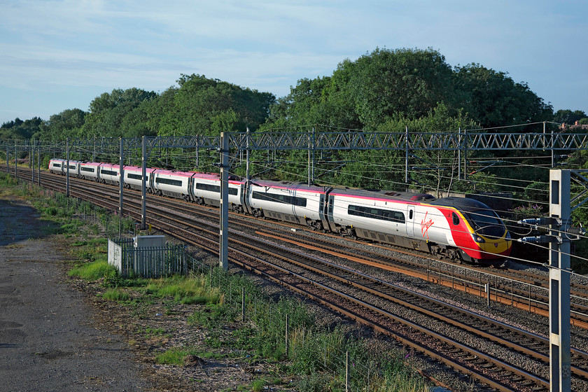 390047, VT 06.16 London Euston-Manchester Piccadilly (1H06, RT), site of Roade station 
 390047 heads north past the site of Roade station (closed 07.09.64) with the 06.16 Euston to Manchester Piccadilly. 
 Keywords: 390047 1H06 site of Roade station