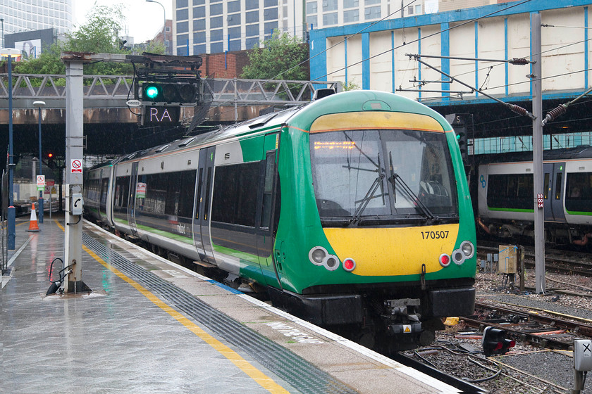 170507, LM 07.59 Birmingham New Street-Hereford (1V22), Birmingham New Street station 
 As the weather was so foul, I opted for a going away shot under the station roof at Birmingham New Street. It shows 170507 leaving working the 07.59 New Street to Hereford a train that was routed via Droitwich, Worcester Foregate Street and Malvern. 
 Keywords: 170507 07.59 Birmingham New Street-Hereford 1V22 Birmingham New Street station