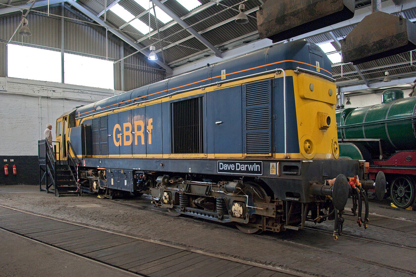 20905, on display, Barrow Hill Roundhouse 
 Looking a little faded long term Barrow Hill resident 20905 'Dave Darwin' sits inside the roundhouse in its GBRf livery. Despite still being mainline registered the future of this locomotive and the remaining Class 20s is precarious with future use on the mainline probably having recently come to an end after some sixty years of service in the case of the very earliest examples. This one carries the nameplate commemorating the career railwayman Dave Darwin who still volunteers at Barrow Hill. 
 Keywords: 20905 on display Barrow Hill Roundhouse