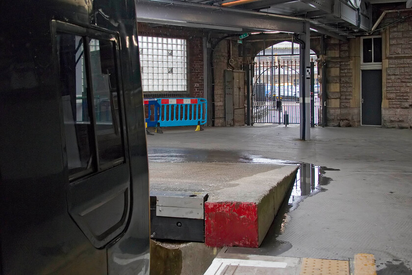 158768, stabled, former Motorail ramp & entrance, Bristol Temple Meads station 
 With 158768 stabled for the day in Bristol Temple Meads' platform one, dubbed the Motorail platform, the ramp can clearly be seen that cars used to drive up on to the open cartic flats. In addition, the gated entrance through the side of the station is seen that permitted car drivers and their vehicles access to the loading ramp. The thing that strikes one is the size of the entrance, back in the 1970s it would have been fine for a Ford Cortina or an Austin Maxi but would today's MPVs get through; I'm not so sure! 
 Keywords: 158768 former Motorail ramp & entrance Bristol Temple Meads station GWR Great Western railway