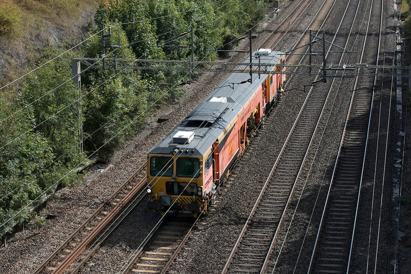 DR73 947, 12.10 Watford London Concrete sidings-Rugby Depot, Roade Cutting 
 Track machine DR73 947 makes its way through Roade Cutting working the 12.10 Watford to Rugby move. I had been tracking this working on the Open Train Times site from when it left Watford slightly early. As it was a Sunday and fairly quiet, control appeared to let it run and it steadily gained time all the way, by the time it got to me here at Roade it was nearly an hour early. 
 Keywords: DR73 947 Roade Cutting