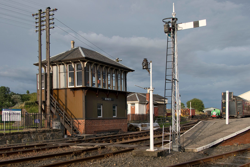 Bo`ness signal box (Ex Garnqueen Junction, Cal, 1889) & station 
 In the lovely evening light, the platform end and signal box are seen at Bo'ness. The box is a traditional Caledonian structure dating from 1889 but was originally located at Garnqueen Junction just north of Coatbridge. The Bo'ness and Kinneil Railway looked to be a great place to visit. Andy and I considered going back the following morning when they were open but decided not to when we realised that were having a Thomas event, indeed, Percy can be seen putting in an appearance in this photograph! 
 Keywords: Bo'ness signal box Ex Garnqueen Junction station