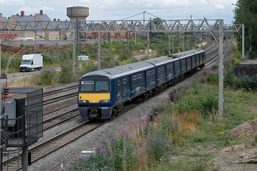 321334, 13.40 London Euston-Mossend (5Z83, 9L), site of Roade station 
 After creating a lot of interest following much testing last year Evershot Rail's bid to develop the Swift Express Freight concept appears to have struggled a little. I have seen few services either in the flesh or flagged up on the various forums. This return run from Scotland to Euston did get a number of notifications so I made the effort to get out and see it. Having travelled up earlier in the day 321334 heads north on the fast line past Roade working the 5Z83 13.40 Euston to Mossend. I am not sure if this was a test or driver training run or if it was an actual loaded service... advice anybody? My last photograph of this particular Class 221 was taken in Essex back in the spring of 2014, see...... https://www.ontheupfast.com/p/21936chg/29996921604/x321334-16-14-wickford-southminster 
 Keywords: 321334 13.40 London Euston-Mossend 5Z83 site of Roade station